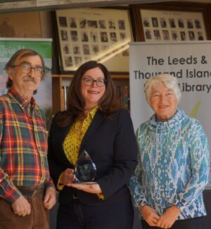 Pierre, Mayor Smith-Gatcke, past TLTI Public Library Chair Brenda Lolley. Three people smiling for a photo