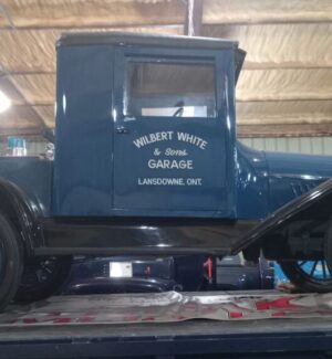 Restored 1918 truck found in a field by a group that included Wilbert White. Someone got a picture of Freda in front of it! A restored 1918 blue truck