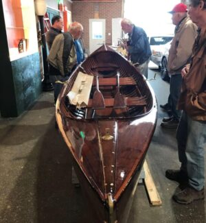 Kevin Tackaberry, back left, was our host & guide. Art Shaw and others take in the details of a lovely St. Lawrence River skiff. A wooden river skiff