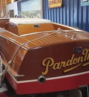 Quite a few boats in the collection with emphasis on Charleston Lake. Wooden boat on display with the painted name "pardon me too"